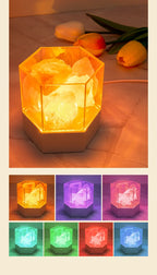 Close-up of pink Himalayan salt chunks glowing inside the modern lamp's clear hexagonal case