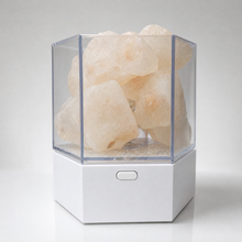 Modern Himalayan salt lamp switched off, showing the pale rough Khewra salt chunks and the single recessed button on the white base