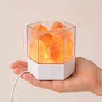 Modern Himalayan salt lamp size shown on a desk with its USB cord visible