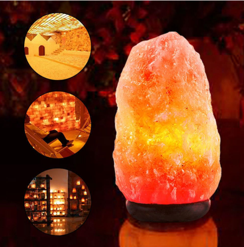 Natural Himalayan pink salt lamp with a hand-carved crystal glowing warm amber