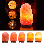 Natural Himalayan pink salt lamp with a hand-carved crystal glowing warm amber