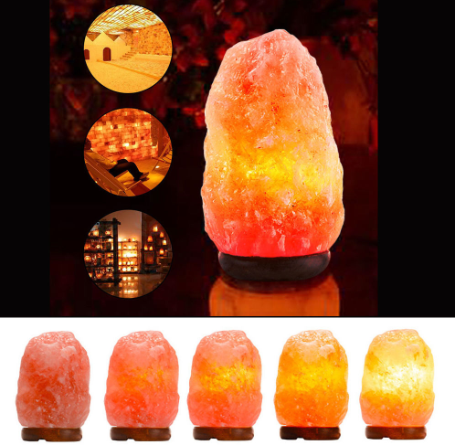 Natural Himalayan pink salt lamp with a hand-carved crystal glowing warm amber