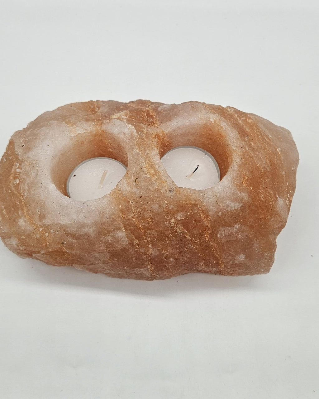 Two well salt candle holder in daylight, showing both wells