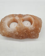 Two well salt candle holder in daylight, showing both wells