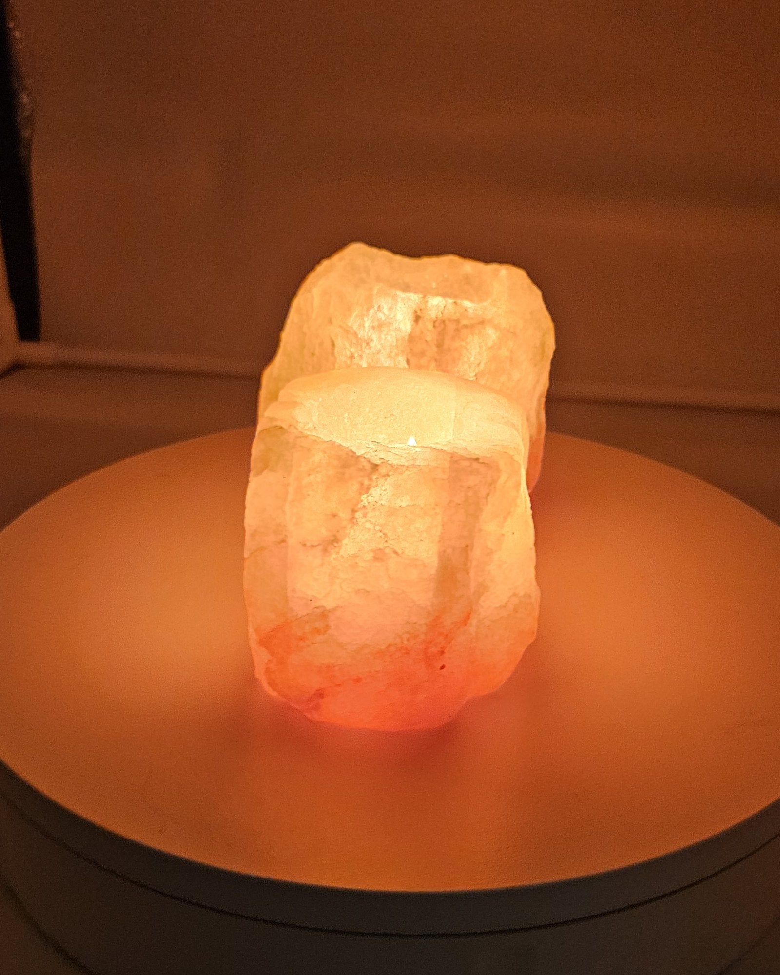 Natural single well salt candle holder, lit