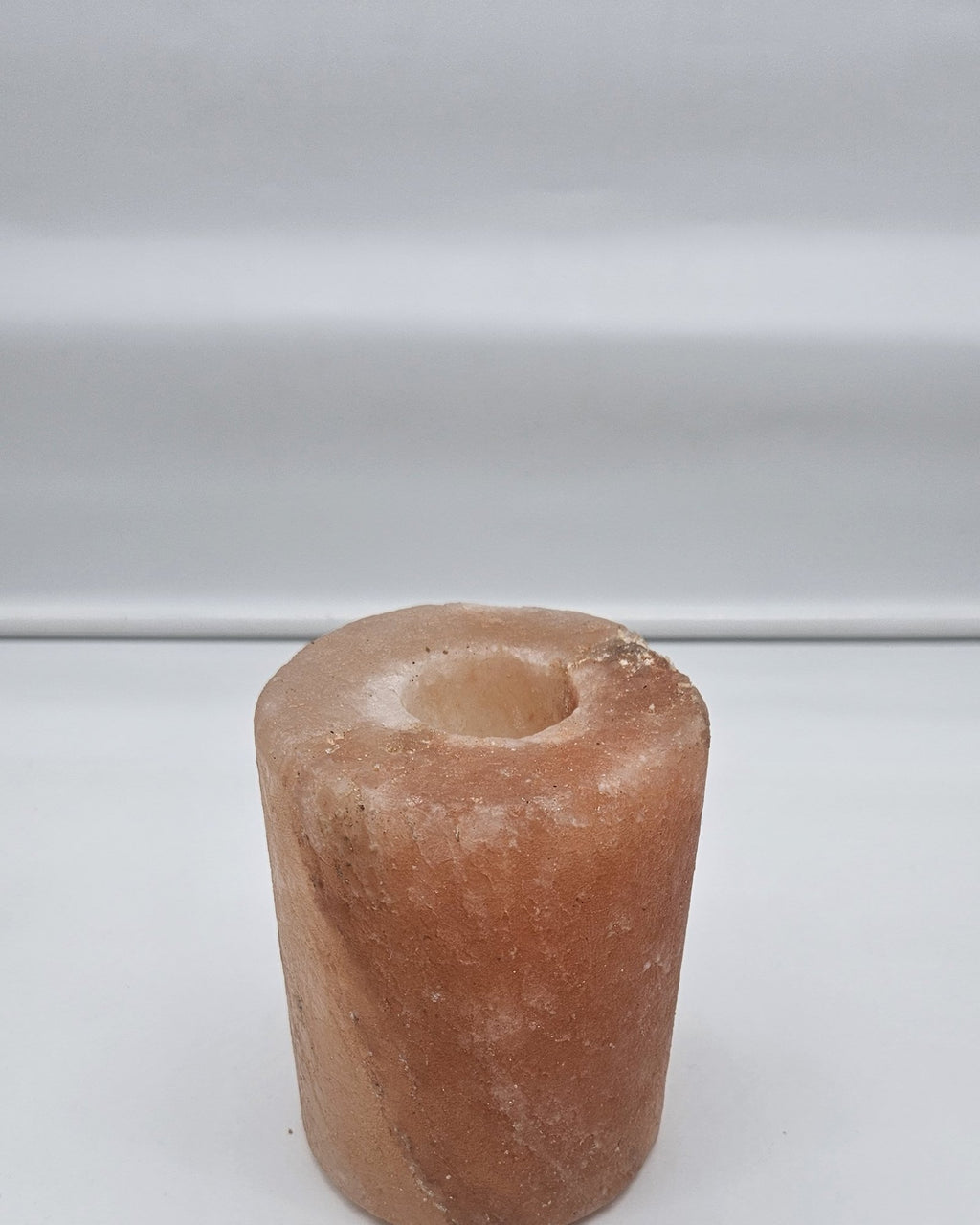 Cylinder salt candle holder showing the tea light well