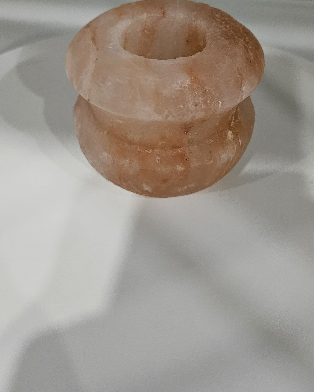 Gourd shaped salt candle holder in daylight