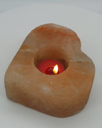 Heart shaped salt candle holder in daylight