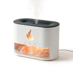 Himalayan salt flame diffuser with cool mist and a warm flame-effect glow over pink salt