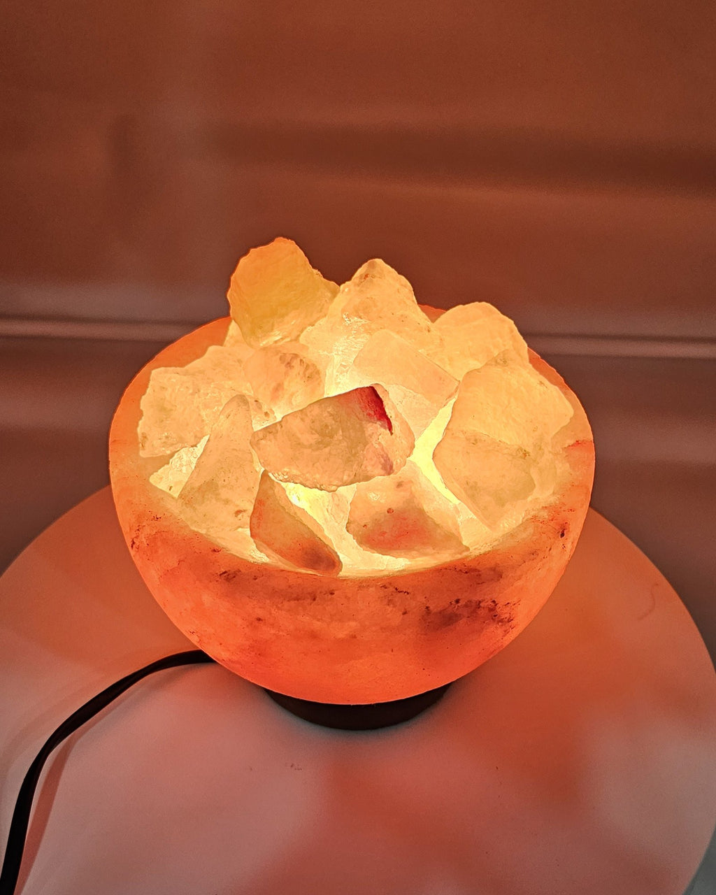 Close view of the lit salt chunks inside the bowl