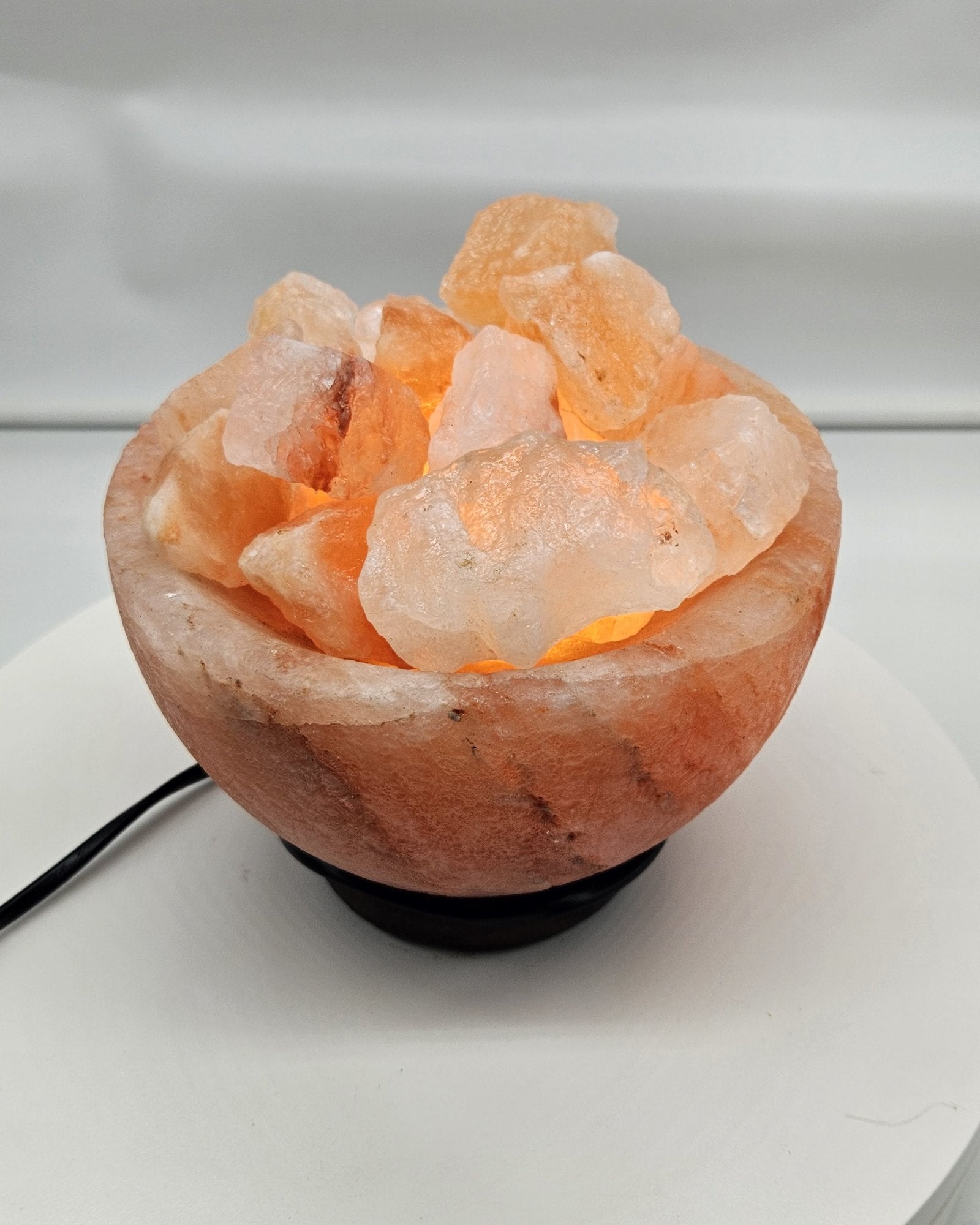Salt bowl lamp in daylight, chunks visible in the bowl