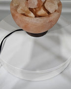 Salt bowl lamp unlit, on a turned base with the power cord visible