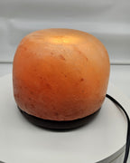 Himalayan salt dome lamp in daylight from the side