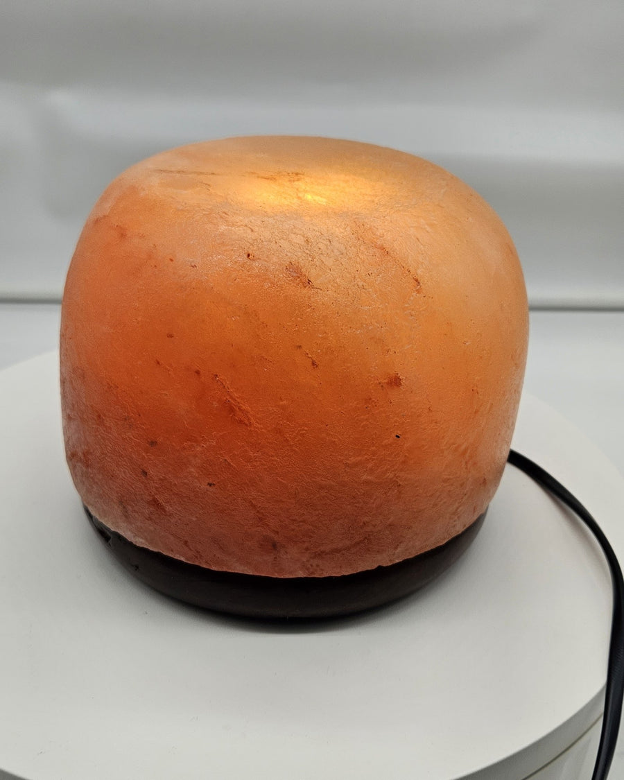 Himalayan salt dome lamp in daylight from the side