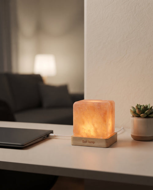 USB Himalayan salt night lamp glowing softly on a work-from-home desk in the evening