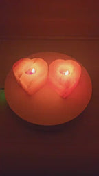 Heart shaped salt candle holder with a lit tea light