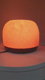 The salt dome lamp lit, turning slowly
