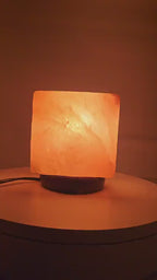 The salt cube lamp lit, turning slowly