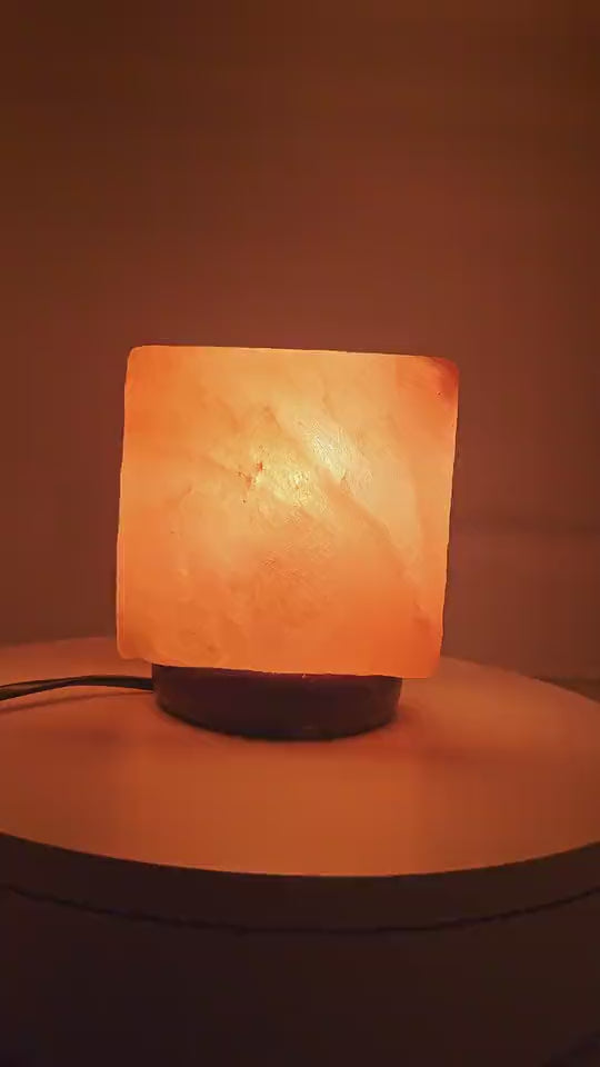 The salt cube lamp lit, turning slowly