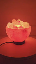 The salt bowl lamp lit, chunks glowing from beneath