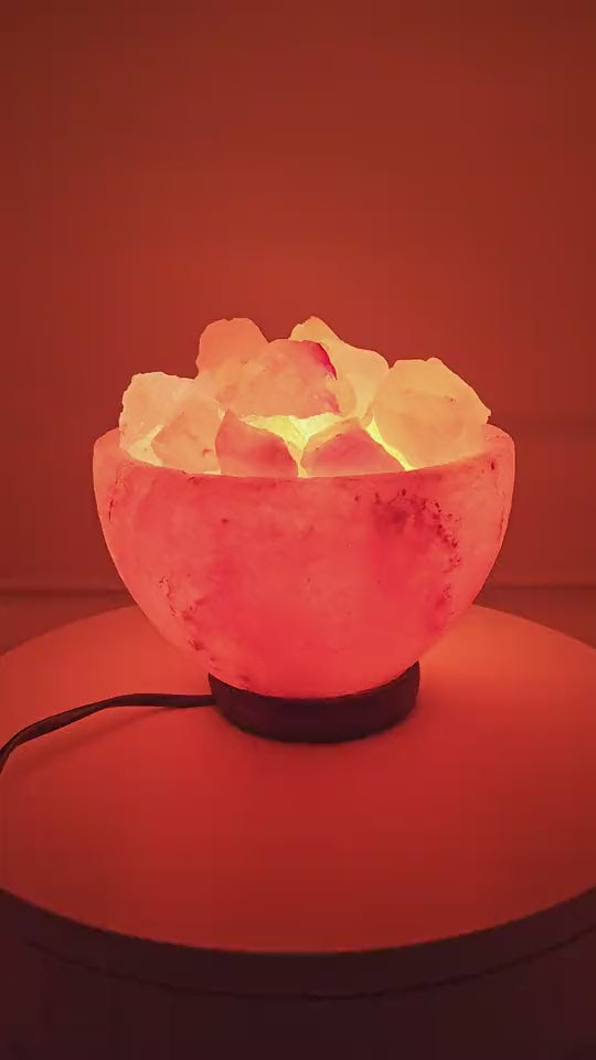 The salt bowl lamp lit, chunks glowing from beneath