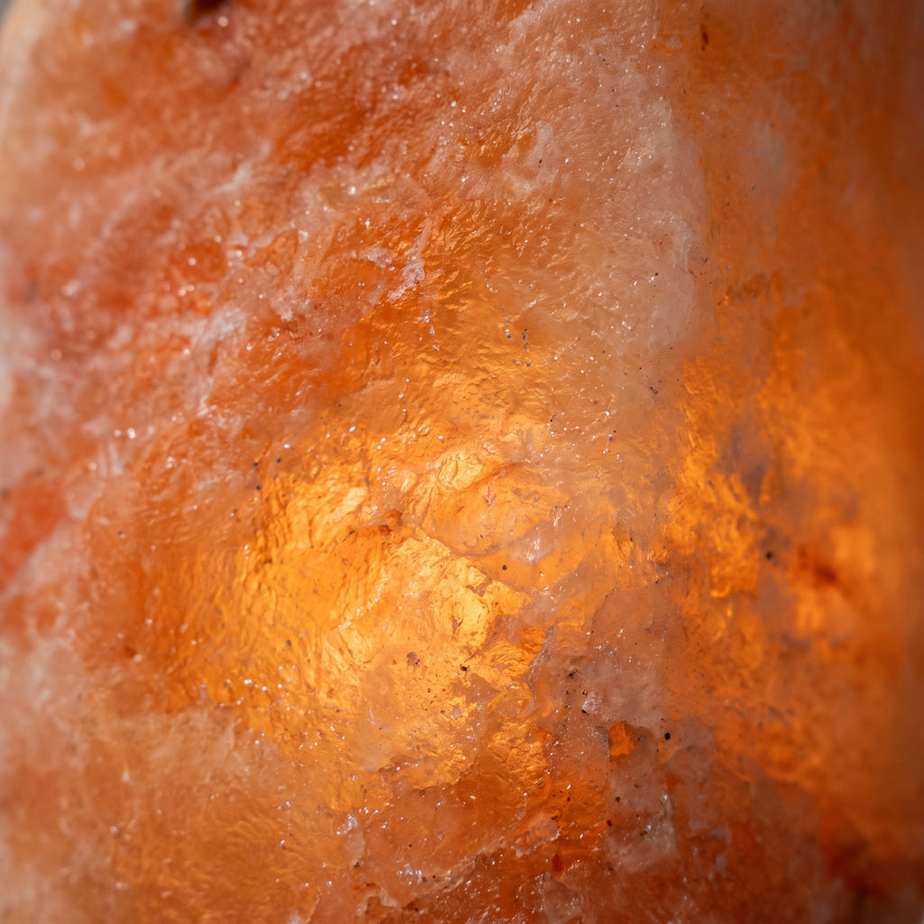 Close-up of the lit crystal surface, natural white veining in salmon-pink salt