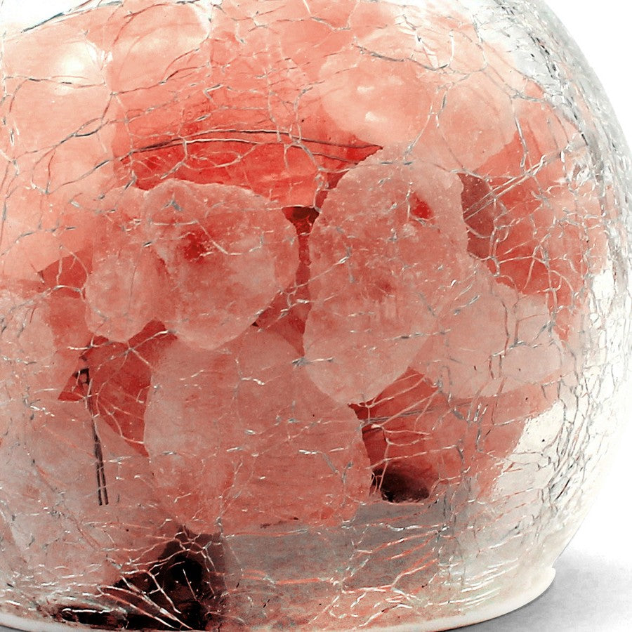 Close up of the crackle glass surface with the rough pink and white Himalayan salt pieces visible through it