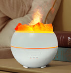 The humidifier running, an orange lit mist plume rising from the centre through the salt pieces, with the power and timer buttons and 1H 3H 6H markings on the base