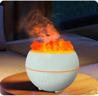 The humidifier lit and misting on a round wooden side table in a living room at night