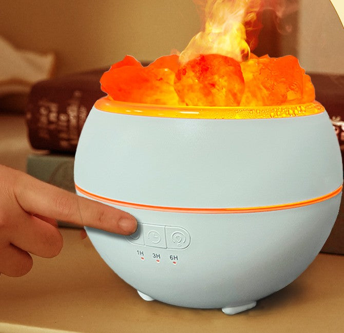 A finger pressing the timer button on the base while the humidifier runs, with the 1H, 3H and 6H indicator lights below the buttons